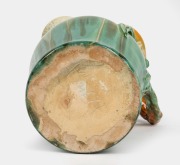 REMUED green glazed pottery jug with applied gumnuts, leaf and branch handle, incised "Remued 54LM", 25.5cm high. - 2