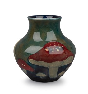 MOORCROFT "Claremont" miniature pottery vase on celadon green ground, impressed "Moorcroft", 8cm high.