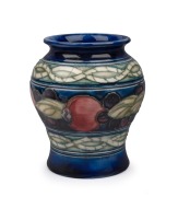 MOORCROFT "Banded Pomegranate" miniature pottery vase on blue ground, impressed "Moorcroft, Made In England", 8cm high.
