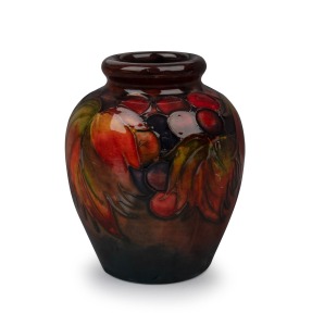 MOORCROFT flambe "Leaves and Berries" miniature pottery vase, impressed signature mark to base "Moorcroft, Potter To H.M. The Queen, Made In England", 8.5cm high.
