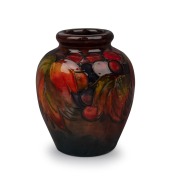 MOORCROFT flambe "Leaves and Berries" miniature pottery vase, impressed signature mark to base "Moorcroft, Potter To H.M. The Queen, Made In England", 8.5cm high.