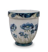 MOORCROFT "Blue Poppy" pattern pottery vase on cream ground, stamped "MACINTYRE, Burslem, England" with "W.M.", ​​​​​​​9cm high.