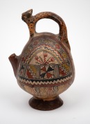 A Nazca pottery stirrup pot with jaguar handle and hand-painted decoration, unknown age, ​​​​​​​21cm high. - 2