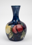 MOORCROFT "Wisteria" miniature pottery stem vase on blue ground, impressed "Moorcroft, Made In England", 9.5cm high.