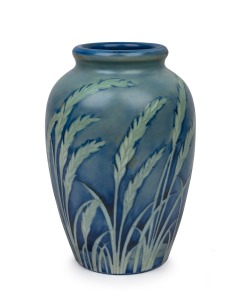MOORCROFT "Wind Swept" salt glazed pottery vase on blue ground, impressed signature mark to base "Moorcroft, Potter To H.M. The Queen, Made In England", 24.5cm high.