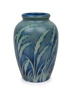 MOORCROFT "Wind Swept" salt glazed pottery vase on blue ground, impressed signature mark to base "Moorcroft, Potter To H.M. The Queen, Made In England", 24.5cm high.