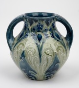 MOORCROFT "Florian Peacock Feather" two handled miniature pottery vase on blue ground, signed "Moorcroft, MADE FOR LIBERTY & CO.", 8cm high. - 2