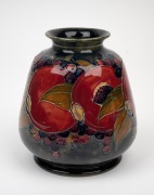 MOORCROFT "Pomegranate" pattern pottery vase on unusual mottled celadon and blue ground, impressed "Moorcroft, Burslem, England" and with green signature mark, 14.5cm high. - 2