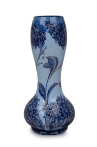 MOORCROFT "Lilac" pattern pottery vase on sky blue ground, stamped "Florian Ware, JAS. MACINTYRE" and signed "W. Moorcroft", 28cm high.