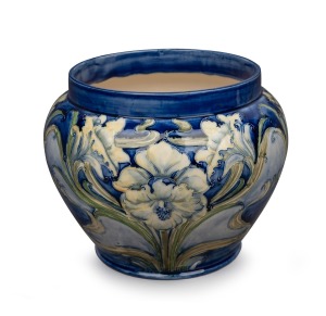 MOORCROFT "Florian Ware Daffodil" pottery jardiniere on blue ground, stamped "Florian Ware" with green signature "W. Moorcroft", 22cm high, 27cm diameter.