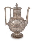 An ornate antique sterling silver coffee pot with floral repousse decoration, retailed by Mansfield & Baird, 19th century, stamped "STERLING", ​​​​​​​27cm high, 870 grams.