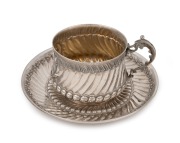 A French silver coffee cup and saucer, 20th century, (2 items), the saucer 13cm diameter, 204 grams total.