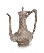 An antique American sterling silver coffee pot with impressive floral repousse decoration, made by Nennen Bates Co. of Baltimore, 19th century, ​​​​​​​23cm high, 554 grams.