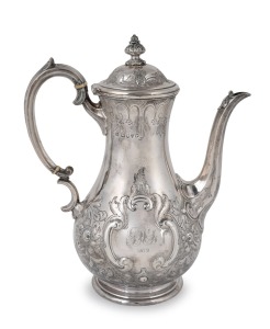 An antique English sterling silver coffee pot with floral repousse decoration, by Martin Hall & Co. of London, circa 1877, 27cm high, 810 grams.