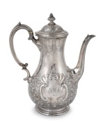 An antique English sterling silver coffee pot with floral repousse decoration, by Martin Hall & Co. of London, circa 1877, ​​​​​​​27cm high, 810 grams.