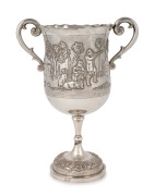 An Indian silver trophy cup with repousse shooting scene, with Calcutta retailer's stamp, 19th century, 25.5cm high, 582 grams.
