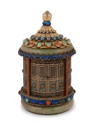 An antique Chinese filigree silver and jade lidded jar with enamel highlights, gilt finish, inlaid with cabochon turquoise and coral, 19th/20th century, stamped "SILVER", 13cm high.