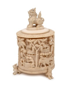 150 · A Burmese carved ivory lidded jar, impressively decorated with assorted rural vignettes with lion feet and finials, 19th/20th century, 18cm high.