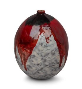 497 · LOUIS DAGE French pottery vase, glazed in ox blood and mottled cream, early 20th century, signed "L. Dage, Made in France", 26cm high.