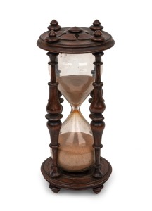 433 · An antique English turned rosewood hourglass carved with English rose, 19th century, 20.5cm high.