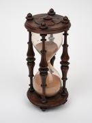 An antique English turned rosewood hourglass carved with English rose, 19th century, 20.5cm high. - 2