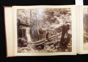 PHOTOGRAPHS OF TASMANIA by J.W. BEATTIE housed in an attractive album with gilt title to the cover, containing 23 albumen prints affixed to pages with hand-written notations and printed captions, images mainly 21 x 26.5 cm. - 8