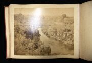 PHOTOGRAPHS OF TASMANIA by J.W. BEATTIE housed in an attractive album with gilt title to the cover, containing 23 albumen prints affixed to pages with hand-written notations and printed captions, images mainly 21 x 26.5 cm. - 12