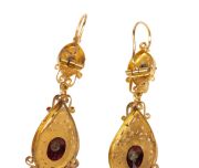 A stunning antique high carat yellow gold cross pendant and matching earrings adorned with two-tone gold florets, set in carbuncle garnets, housed in original leather case with blue silk interior, circa 1860, ​​​​​​​the cross an impressive 9cm high, 19 gr - 6