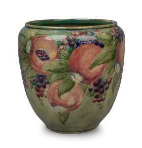 MOORCROFT early "Pomegranate" pattern pottery jardiniere on rare celadon green ground, signed "Moorcroft", 25cm high.