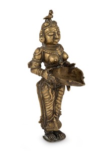 An antique Burmese cast bronze statue of a woman, 19th/20th century, 23.5cm high.