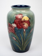 MOORCROFT "Fresia" pattern pottery vase on green and blue ground, impressed signature mark "Moorcroft, Made In England, Potter To H.M. The Queen", ​​​​​​​32cm high. - 2