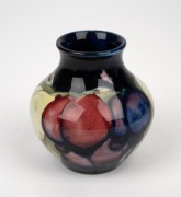 MOORCROFT "Wisteria" pottery vase on blue ground, impressed "Moorcroft, Made In England", 8cm high. - 2