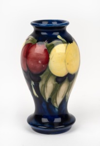 MOORCROFT "Wisteria" English pottery vase on blue ground, with impressed "Moorcroft, England" 10.5cm high.