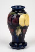 MOORCROFT "Wisteria" English pottery vase on blue ground, with impressed "Moorcroft, England" 10.5cm high. - 2