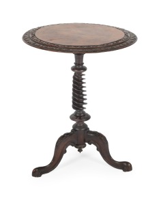 An antique Irish burr walnut wine table with ornately turned barley twist column and carved decoration, circa 1865, 63cm high, 50cm diameter.