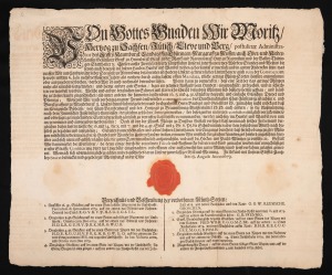 A 1679 document in German, detailing a proclamation regarding financial matters, printed in fraktur typeface with red wax seal, 33 x 40cm.