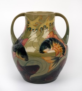MOORCROFT "Fish" pattern two handled pottery vase on celadon green ground, impressed stamp "Moorcroft, Made In England", signed "J. Moorcroft. RAVI TIKKOO: With Best Wishes From All Your Friends At Richard Butler. 1995", 33cm high.