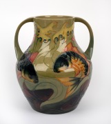 MOORCROFT "Fish" pattern two handled pottery vase on celadon green ground, impressed stamp "Moorcroft, Made In England", signed "J. Moorcroft. RAVI TIKKOO: With Best Wishes From All Your Friends At Richard Butler. 1995", 33cm high.