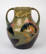 MOORCROFT "Fish" pattern two handled pottery vase on celadon green ground, impressed stamp "Moorcroft, Made In England", signed "J. Moorcroft. RAVI TIKKOO: With Best Wishes From All Your Friends At Richard Butler. 1995", 33cm high. - 3