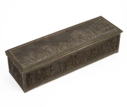 An antique French bronze jewellery casket with red velvet interior, 19th century, 8cm high, 33cm wide, 20cm deep.