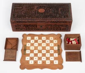 216 · An antique Chinese carved sandalwood box, housing a pocket chess set with carved bone pieces and a boxed Chinese puzzle with lithograph label, 19th/20th century, ​​​​​​​the box 24.5cm wide.
