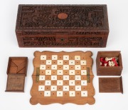 An antique Chinese carved sandalwood box, housing a pocket chess set with carved bone pieces and a boxed Chinese puzzle with lithograph label, 19th/20th century, ​​​​​​​the box 24.5cm wide.