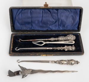 138 · Three antique silver handled button hooks, sterling silver fork and an Eastern silver letter opener in the form of a Kris, 19th/20th century, (6 items), the largest 18cm long.