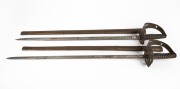 Two Burmese military parade swords in brass scabbards with engraved blades, mid 20th century, ​​​​​​​93cm long.