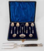 Antique English sterling silver Apostle teaspoons with tongs and strainer, together with a silver plated bread fork, 19th/20th century, 60 grams silver weight.