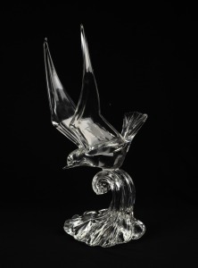 A Murano clear glass flying bird sculpture, bearing circular red and gold foil label "Made in Murano, Italy", 38cm high.
