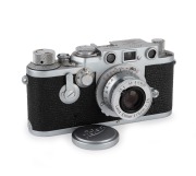 LEITZ: Red-dial (self-timer, Wetzlar) Leica IIIf film camera [#723686], c. 1950, with Elmar 50mm f3.5 lens [#1122175] and Leica lens cap.