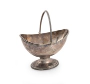 A Georgian sterling silver bon bon basket with engraved family crest, made in London, circa 1784, 16cm high, 215 grams.