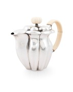 JOSEF HOFFMANN (1870-1956), WIENER WERKST&Auml;TTE stunning Austrian silver and ivory tea service, comprising a teapot, milk jug, sugar bowl, sugar tongs and tray, circa 1918. This model tea service was exhibited at the, Arts Decoratifs Et Industriels Modernes - 3