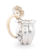 JOSEF HOFFMANN (1870-1956), WIENER WERKST&Auml;TTE stunning Austrian silver and ivory tea service, comprising a teapot, milk jug, sugar bowl, sugar tongs and tray, circa 1918. This model tea service was exhibited at the, Arts Decoratifs Et Industriels Modernes - 4